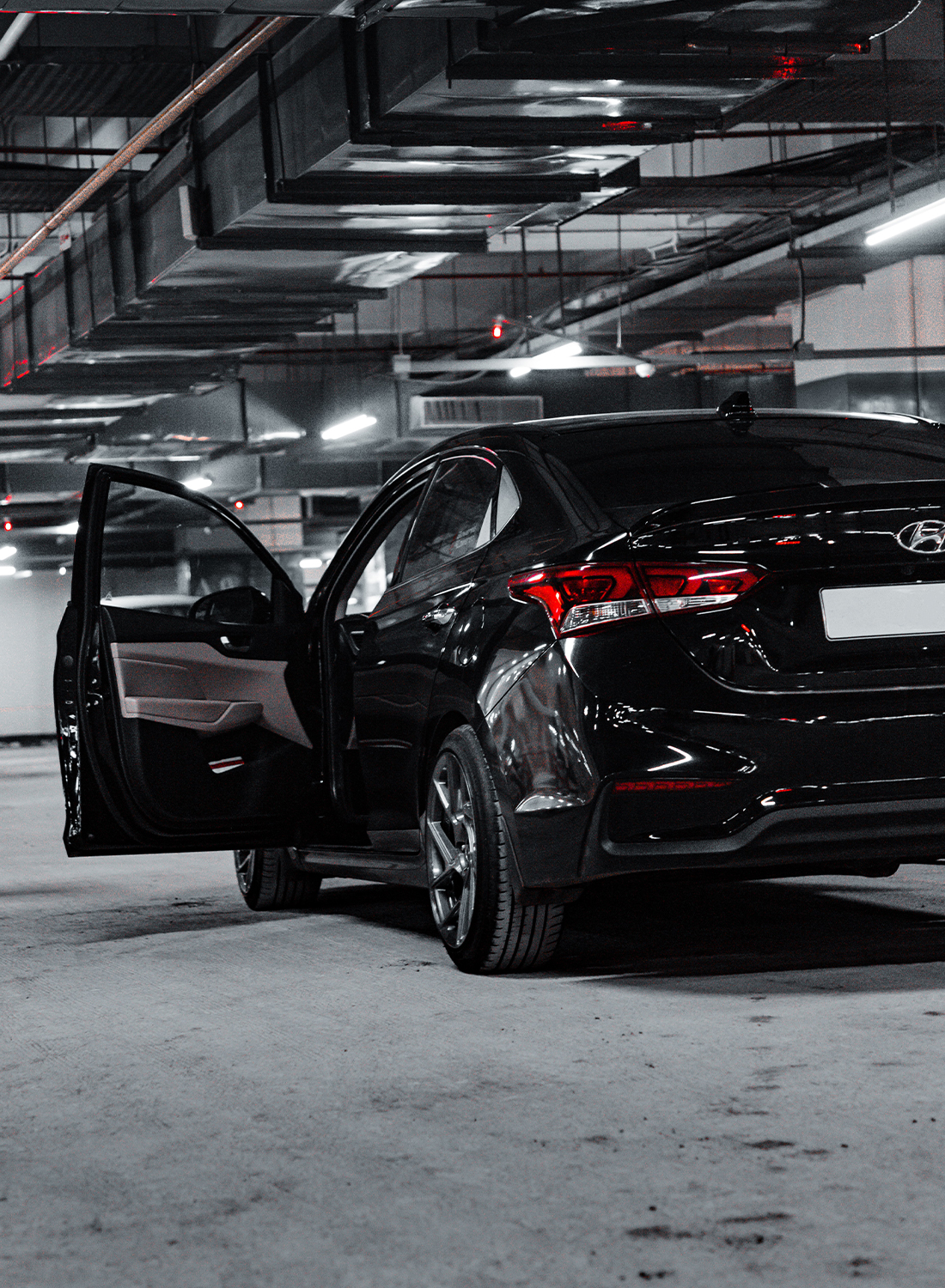 black car in parking garage